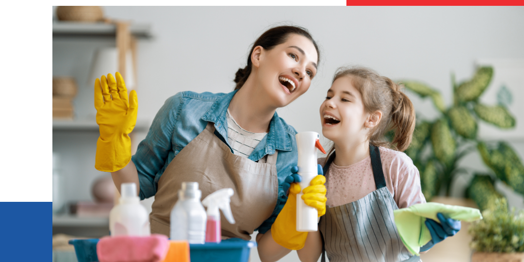 A woman and a child happily cleaning the living room.