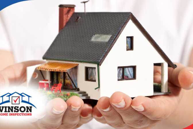 Vinson Home Inspections (8) Hands holding a model house representing home protection and inspection services.