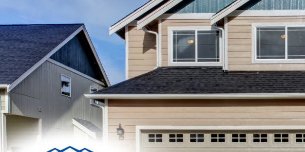 Contemporary two-story home with a clean driveway and light beige siding