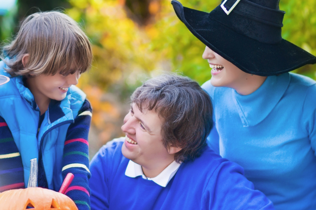Vinson Home Inspections (3) Family enjoying Halloween pumpkin carving outdoors