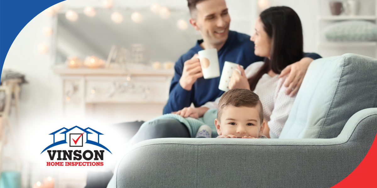 Vinson Home Inspections (9) Young family relaxing on a cozy couch, sharing a warm moment at home.