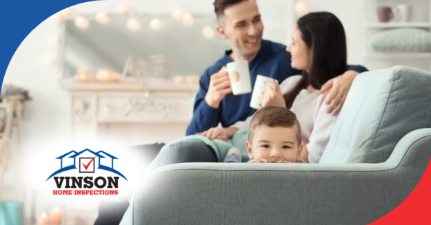 Young family relaxing on a cozy couch, sharing a warm moment at home.