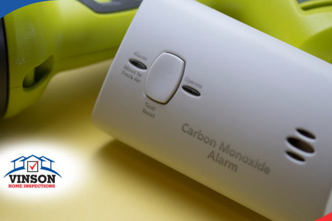 Vinson Home Inspections (15) Carbon monoxide alarm placed next to a flashlight