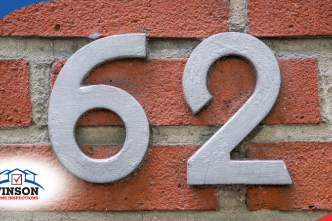 Vinson Home Inspections Gray house number 62 on a red brick wall