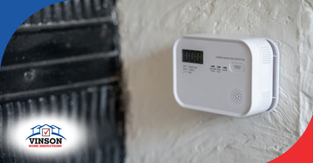 Carbon monoxide detector with digital display mounted on a wall.